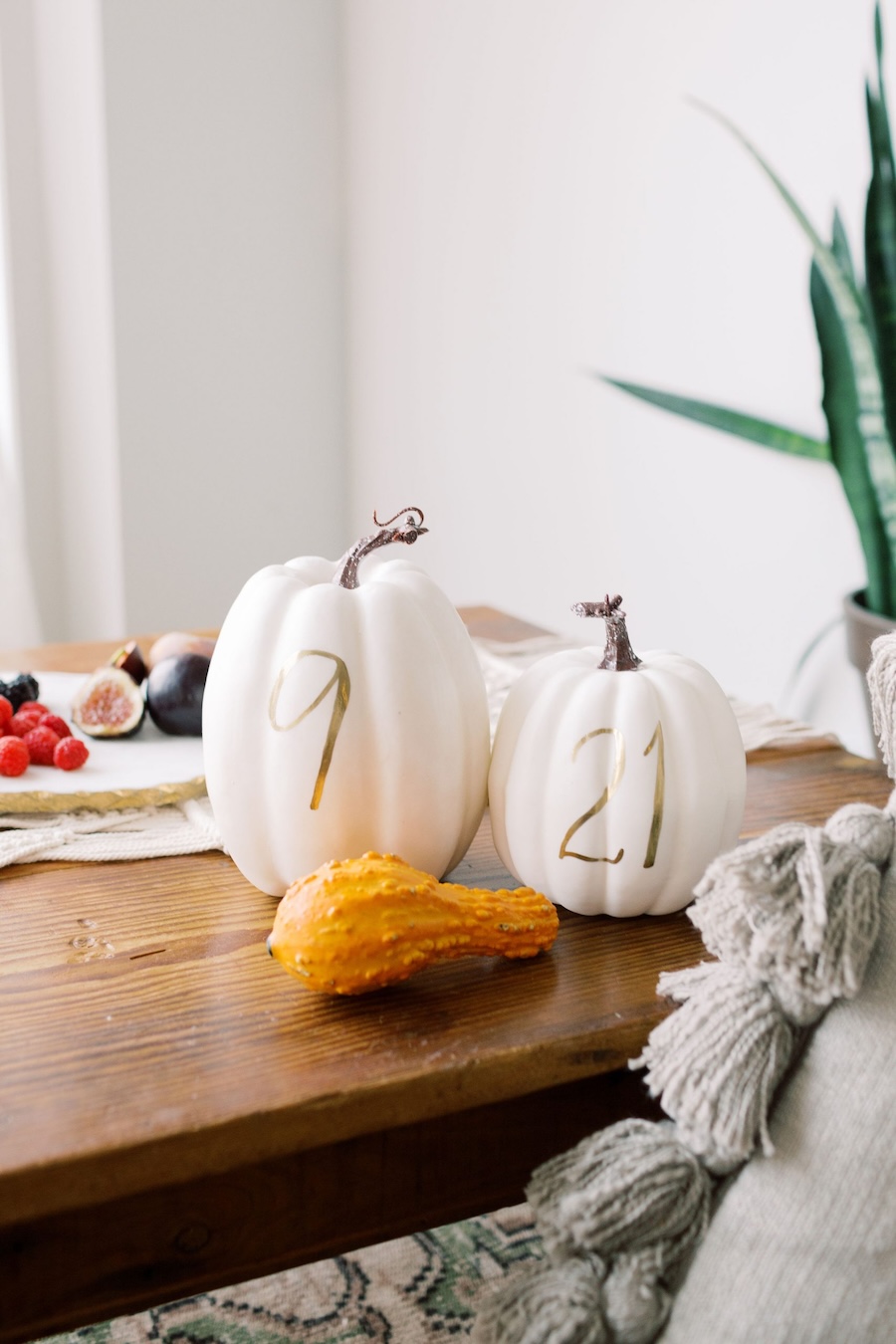 white pumpkins with calligraphy painted numbers, creative table numbers, laura hooper design house