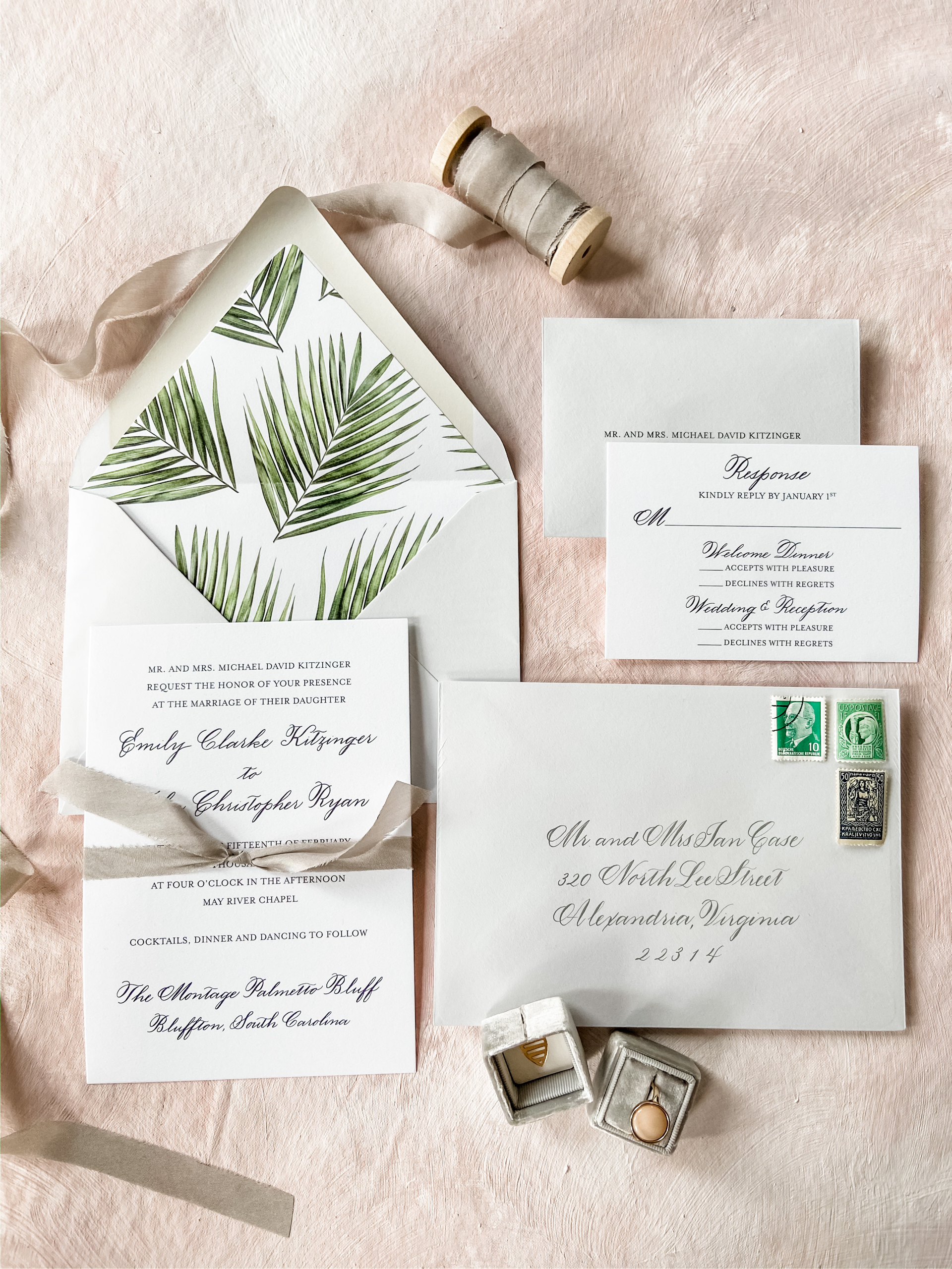 Elegant custom wedding invitation suite with custom hand calligraphy on extra thick card stock with light gray envelopes with hand painted water color palm leaf envelop liners by Laura Hooper Design House.