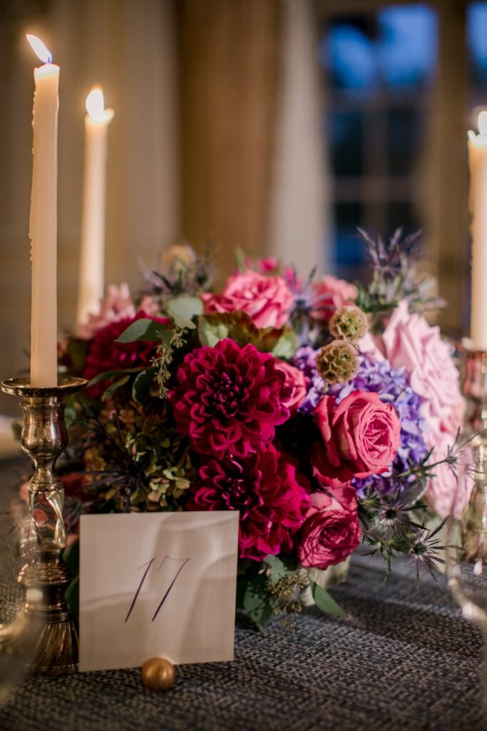 Simple calligraphy wedding table number signs. Pink and purple floral centerpieces for washington dc wedding. Laura Hooper Design House. 