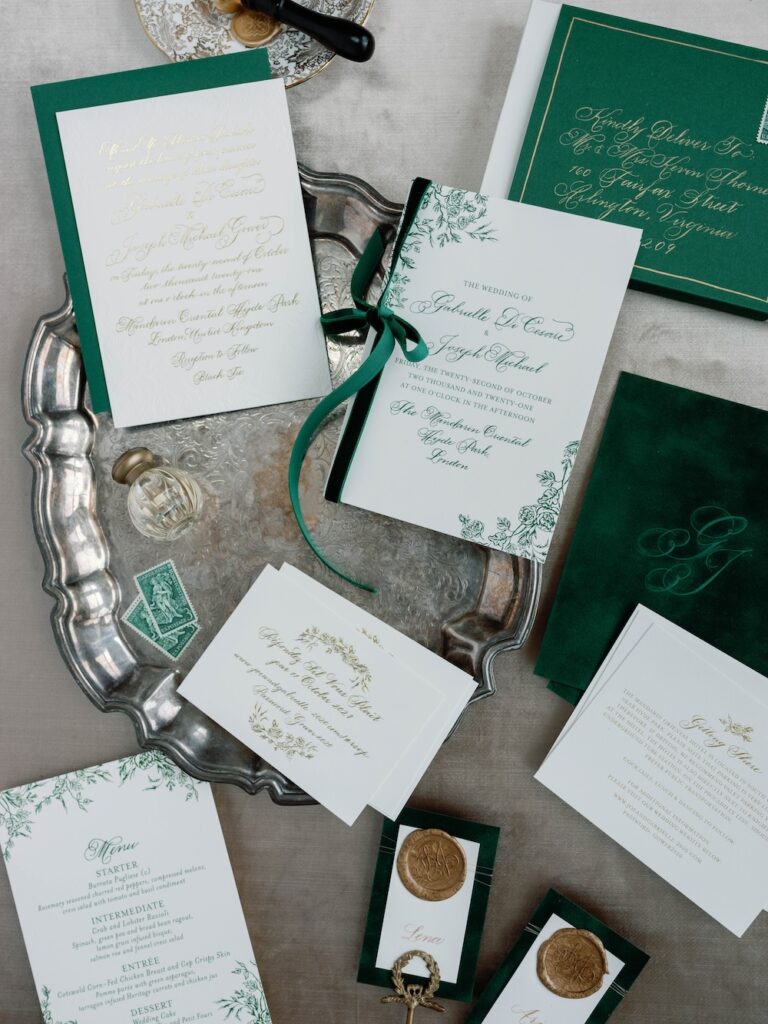 Custom wedding invitation set and paper details with gold calligraphy and green velvet by Laura Hooper Design House