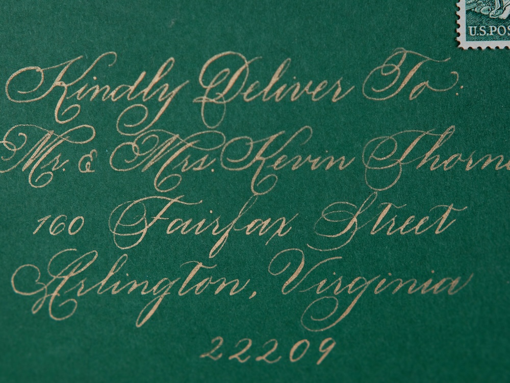 Hand calligraphy in gold on green envelope, custom wedding invitation, by Laura Hooper Design House