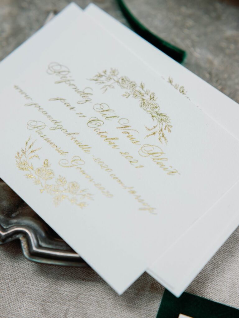 Custom wedding rsvp card with gold calligraphy and floral details by Laura Hooper Design House