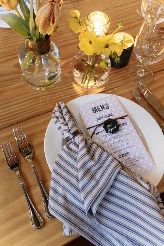 Blue patterned custom dinner menus with calligraphy name tags by Laura Hooper Design House. 