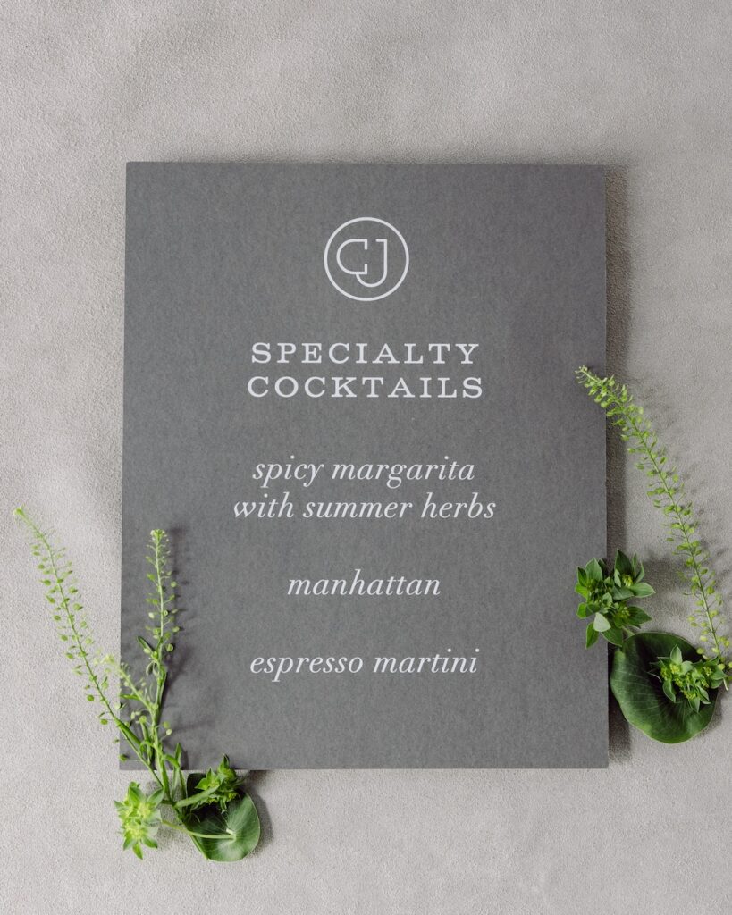 Custom grey and white specialty drink menu with monogram, Laura Hooper Design House. 