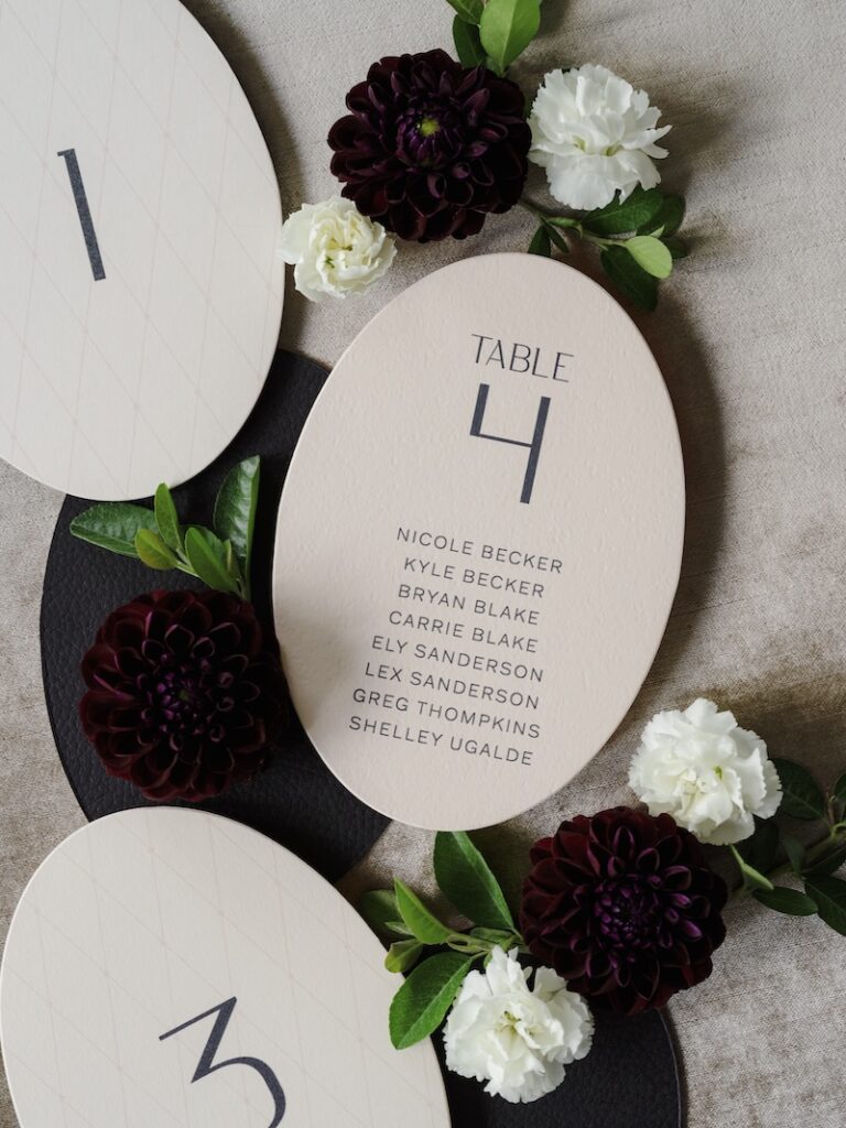Custom wedding stationery & paper details, oval table number cards with modern typography. Laura Hooper Design House. 