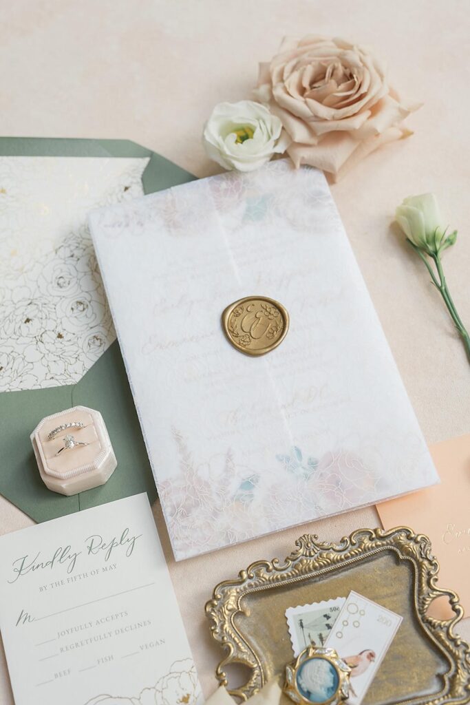 Custom monogram wax seal on vellum wedding invitation wrap, laura hooper design house