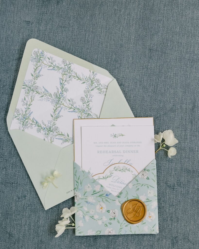 Elegant pastel green and blue wedding invitation set with custom floral watercolor art. Laura Hooper Design House