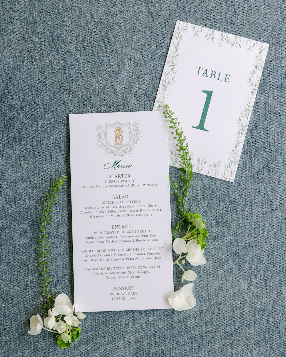 Custom watercolor floral wedding menu and table number signs. Laura Hooper Design House.