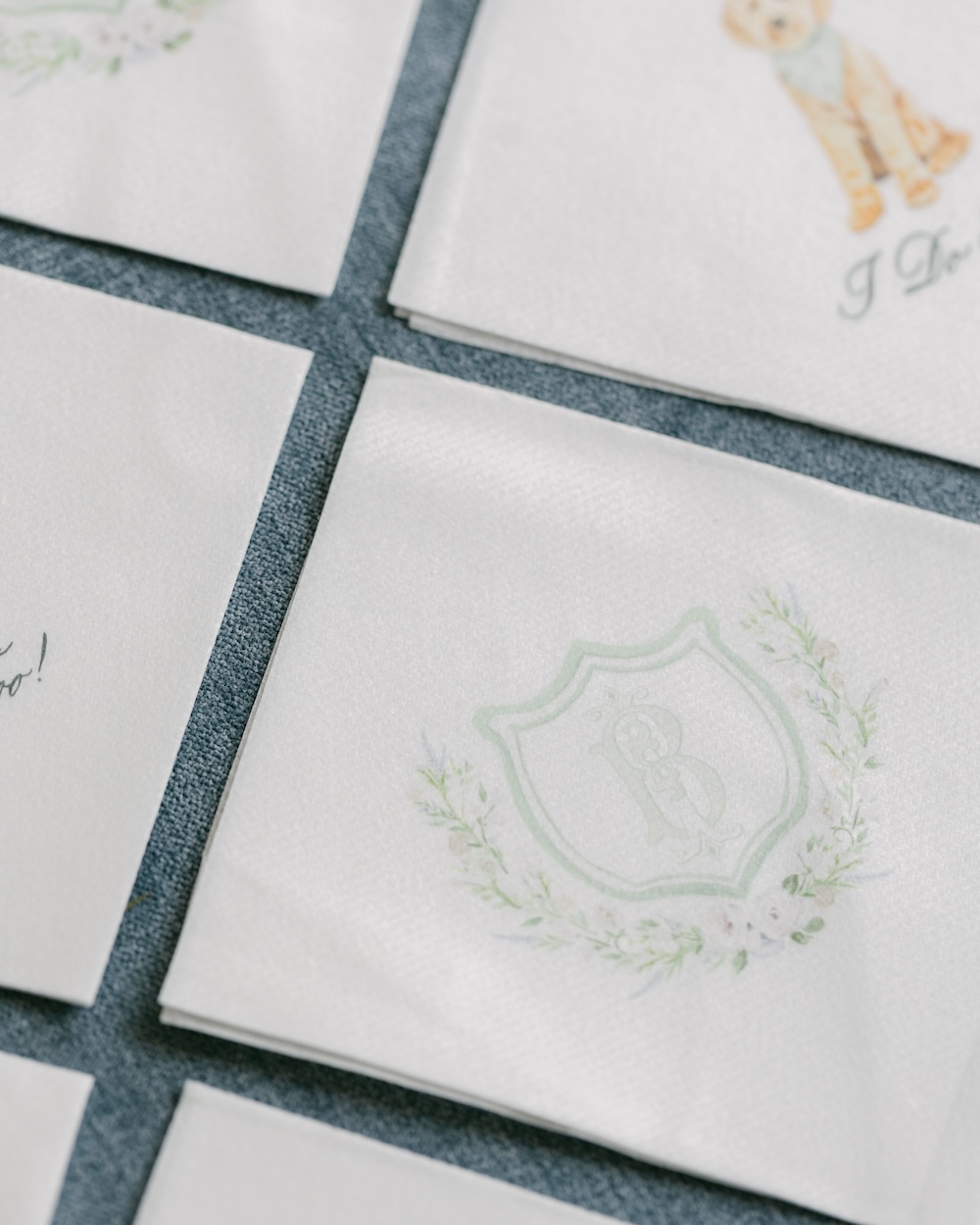 Custom monogram crest wedding cocktail napkins. Laura Hooper Design House.