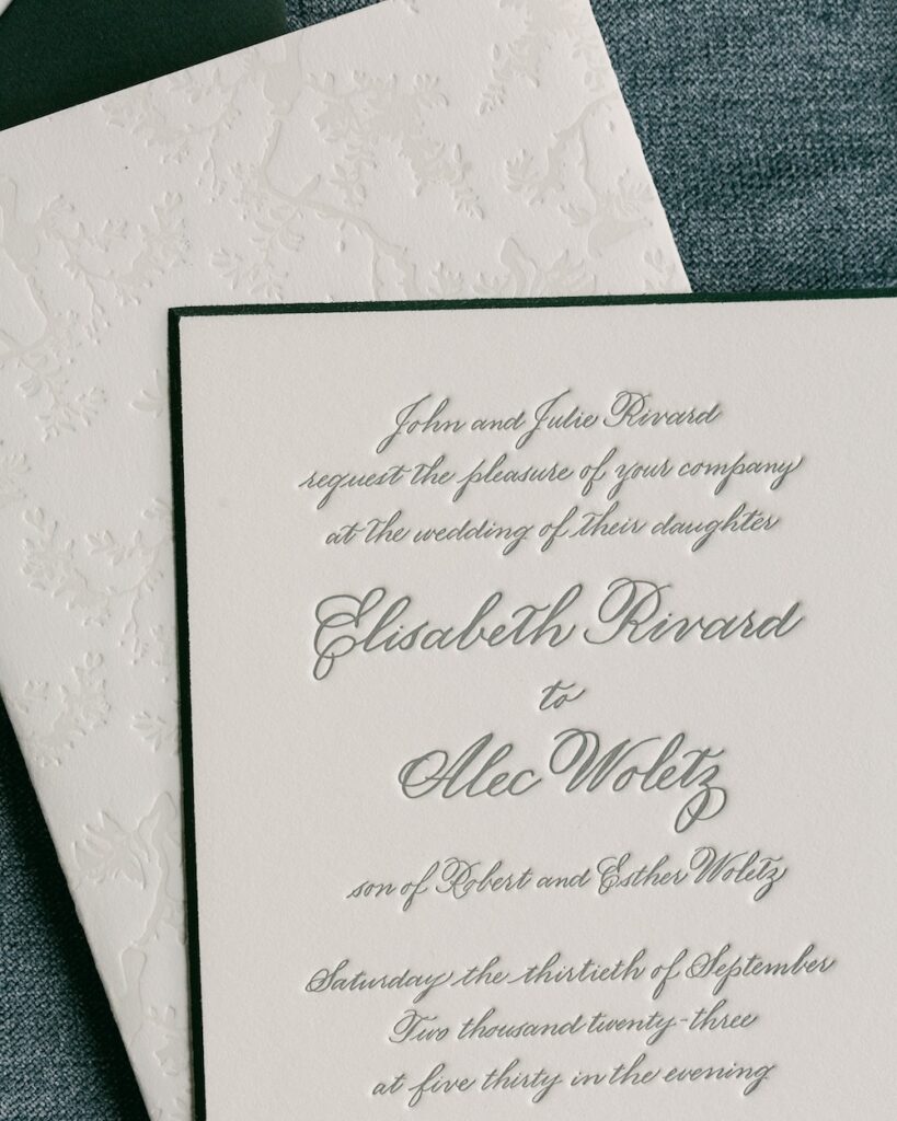 Custom letterpress wedding invitation card with racing green beveled edge, emboss design on back. Laura Hooper Design House.