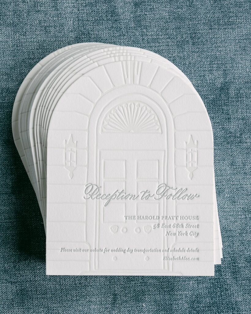 Rounded edge wedding reception details card with letterpress building design in background. Laura Hooper Design House. 