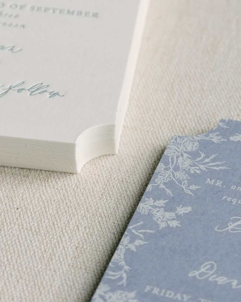 Dusty blue and white wedding stationery, die cut, letterpress, digital printed cards. Custom invitation design. Laura Hooper Design House.