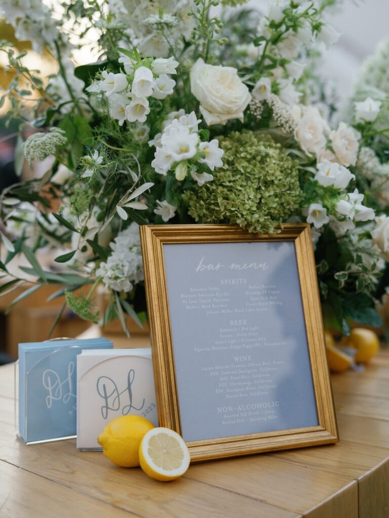 Dusty blue wedding bar sign with printed calligraphy, custom monogrammed cocktail napkins. laura hooper design house. 